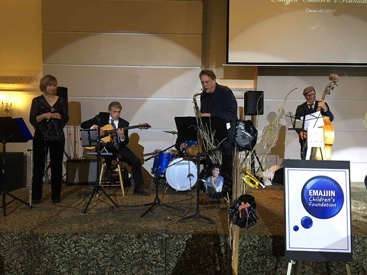 A band performing on stage at the 2018 Denim and Diamonds gala