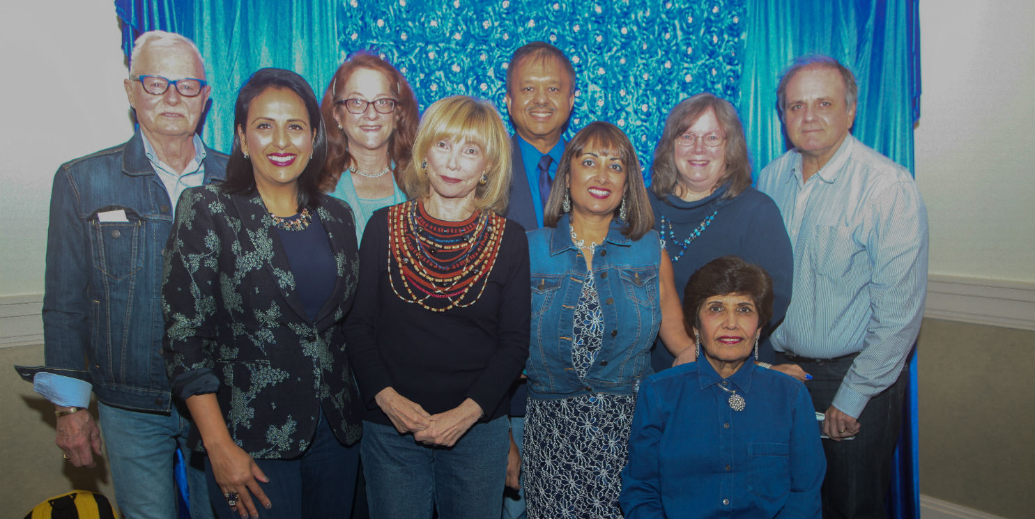 The 2018 Emajjin Children's Foundation Board of Directors posing together in denim at the gala