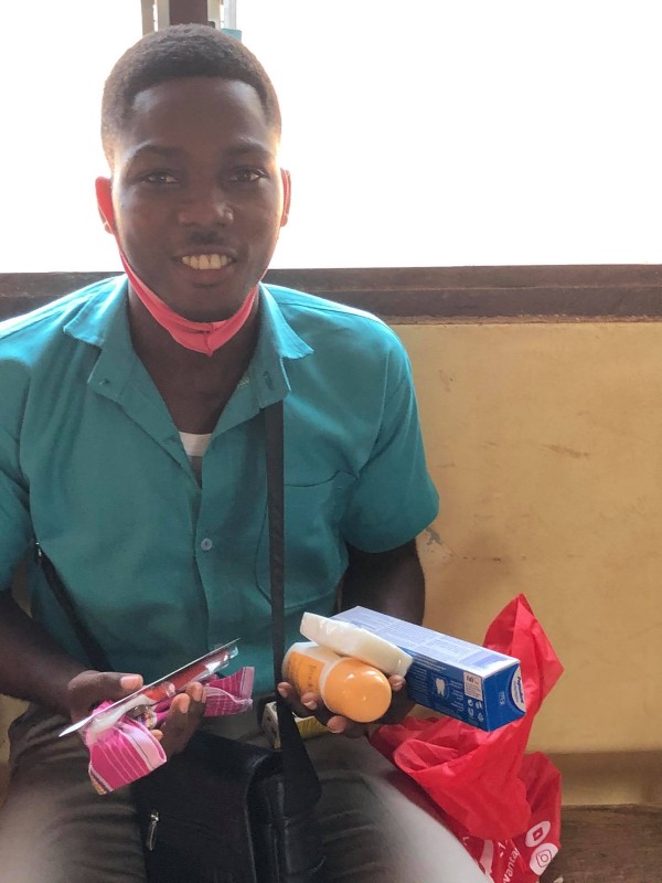 A student holding supplies received in a hygiene kit from DSDO during Health Week 2021