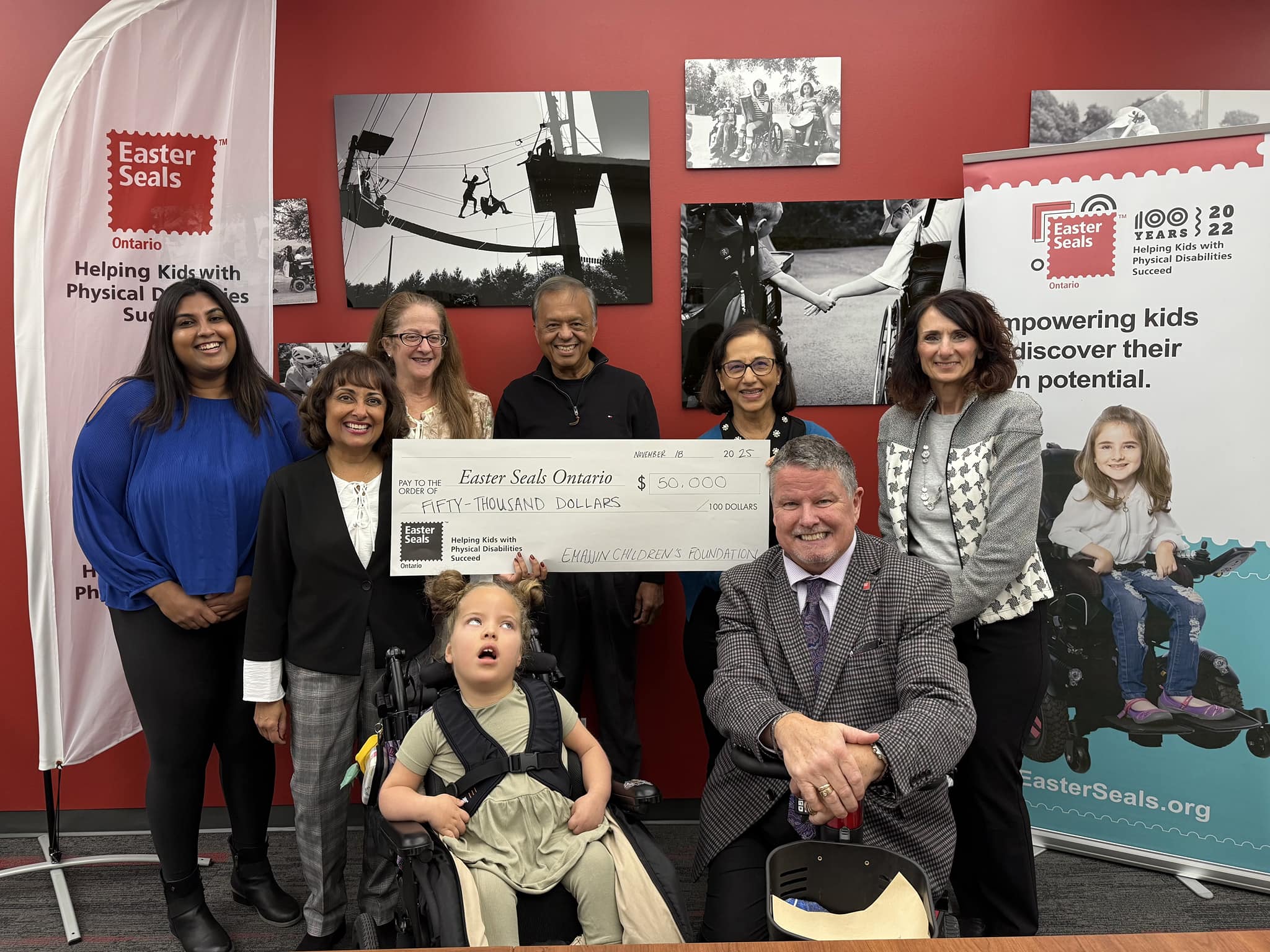 Emajjin board members presenting a $50,000 cheque to Easter Seals Ontario at their office