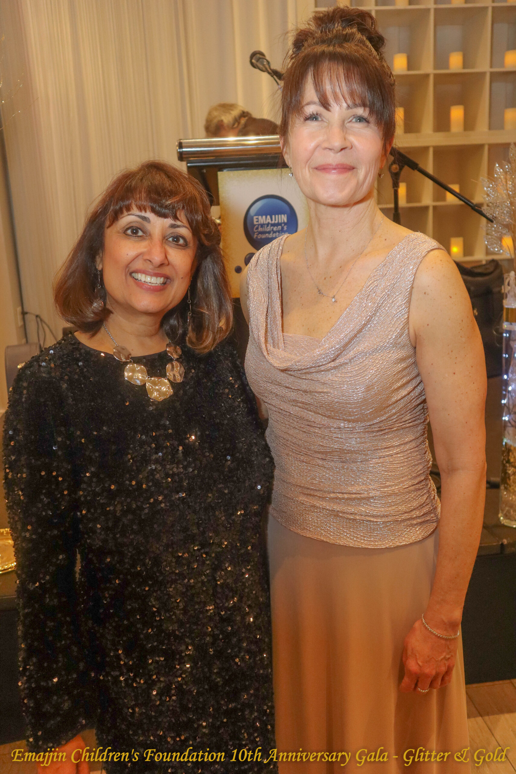 Emajjin Co-founder Jyoti Sanwalka and Tumaini Children's Foundation's Executive Director Leslie Butler smiling into the camera together.